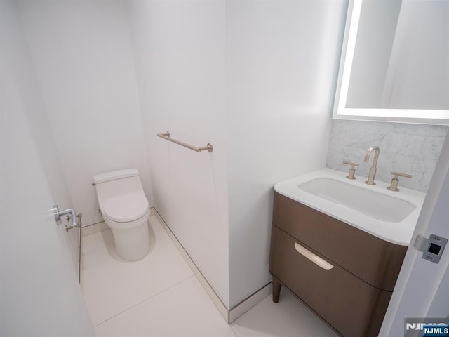 320 Adolphus Ave Unit 401, Cliffside Park, NJ 07010 - half bath with toilet, vanity, backsplash, and tile patterned flooring