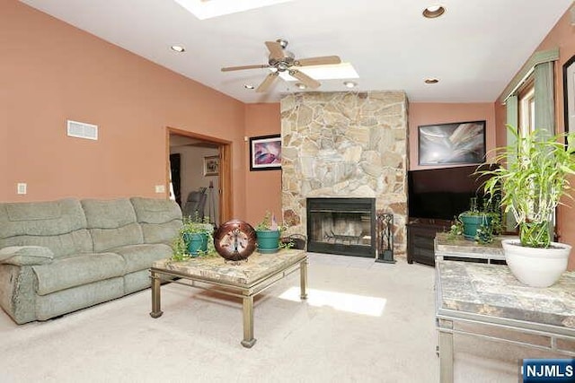 64 Lunn Ave, Bergenfield, NJ 07621 - carpeted living area featuring ceiling fan, a skylight, a stone fireplace, and recessed lighting