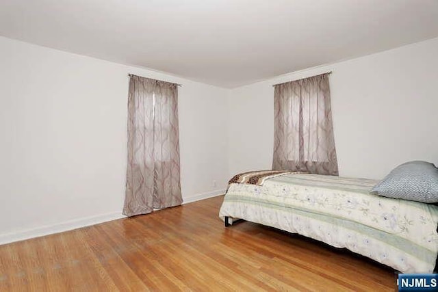 64 Lunn Ave, Bergenfield, NJ 07621 - bedroom with wood finished floors and baseboards