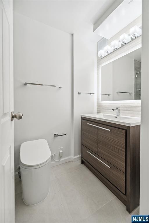 200 Winston Unit 121, Cliffside Park, NJ 07010 - bathroom with vanity, toilet, and baseboards