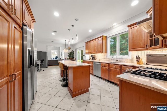 4 Michelle Ct, Harrington Park, NJ 07640 - kitchen featuring appliances with stainless steel finishes, tasteful backsplash, a kitchen island, a breakfast bar, and a sink