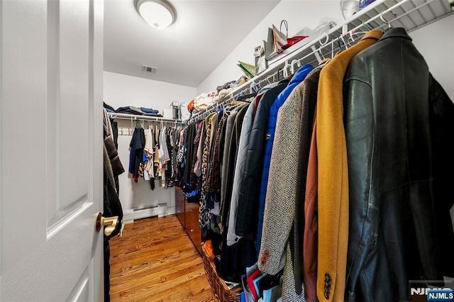 4 Michelle Ct, Harrington Park, NJ 07640 - spacious closet featuring wood finished floors and a baseboard radiator