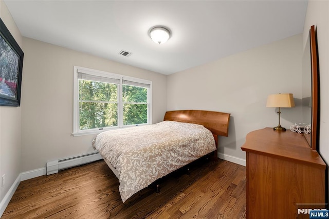 4 Michelle Ct, Harrington Park, NJ 07640 - bedroom with baseboard heating, wood finished floors, and baseboards