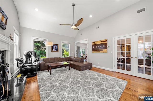 4 Michelle Ct, Harrington Park, NJ 07640 - living area featuring ceiling fan, french doors, wood finished floors, high vaulted ceiling, and a fireplace