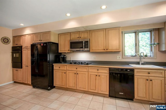 42 Lohs Pl, Harrington Park, NJ 07640 - kitchen with black appliances, a sink, a warming drawer, light tile patterned flooring, and dark countertops