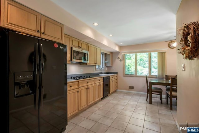 42 Lohs Pl, Harrington Park, NJ 07640 - kitchen featuring black appliances, a sink, light tile patterned flooring, recessed lighting, and baseboards