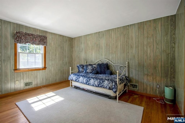 42 Lohs Pl, Harrington Park, NJ 07640 - bedroom featuring wood finished floors, baseboards, and wooden walls