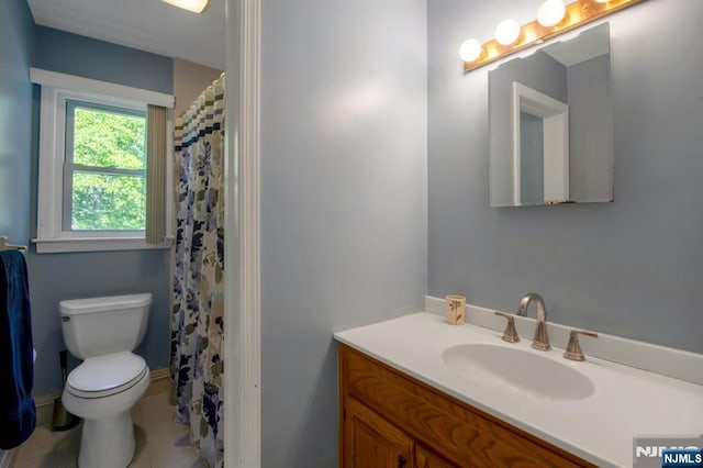 42 Lohs Pl, Harrington Park, NJ 07640 - bathroom featuring toilet, vanity, and tile patterned flooring