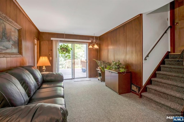42 Lohs Pl, Harrington Park, NJ 07640 - carpeted living area featuring wooden walls, stairway, and crown molding