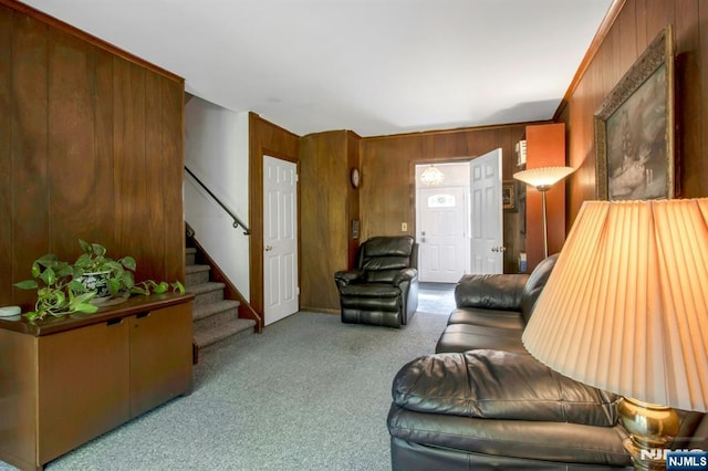 42 Lohs Pl, Harrington Park, NJ 07640 - living room featuring carpet floors, wood walls, and stairway