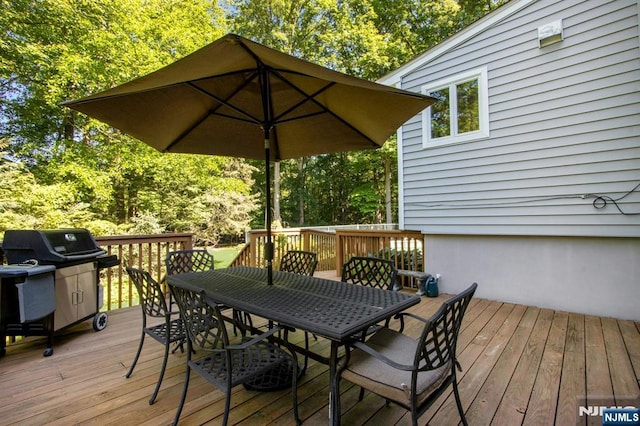 42 Lohs Pl, Harrington Park, NJ 07640 - wooden deck with outdoor dining area