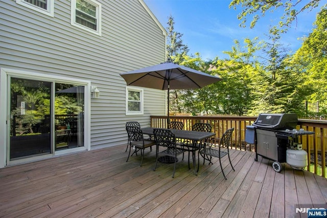 42 Lohs Pl, Harrington Park, NJ 07640 - deck with outdoor dining space and a grill