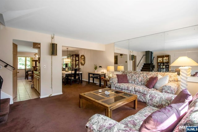 42 Lohs Pl, Harrington Park, NJ 07640 - carpeted living room featuring stairway, a chandelier, and baseboards