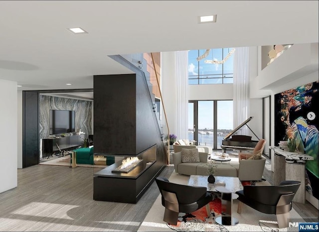 320 Adolphus Ave Unit 1115, Cliffside Park, NJ 07010 - living area featuring a high ceiling, a chandelier, stairway, and wood finished floors