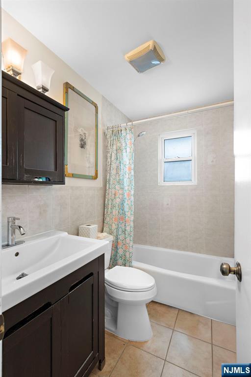 6 Gail Pl, Secaucus, NJ 07094 - full bath with vanity, tile walls, shower / tub combo, and tile patterned flooring