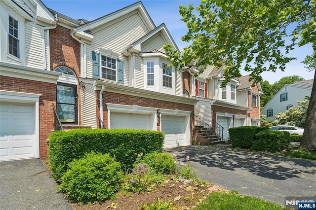 315 Winthrop Dr Unit 3082, Nutley, NJ 07110 - townhome / multi-family property featuring driveway, an attached garage, and brick siding