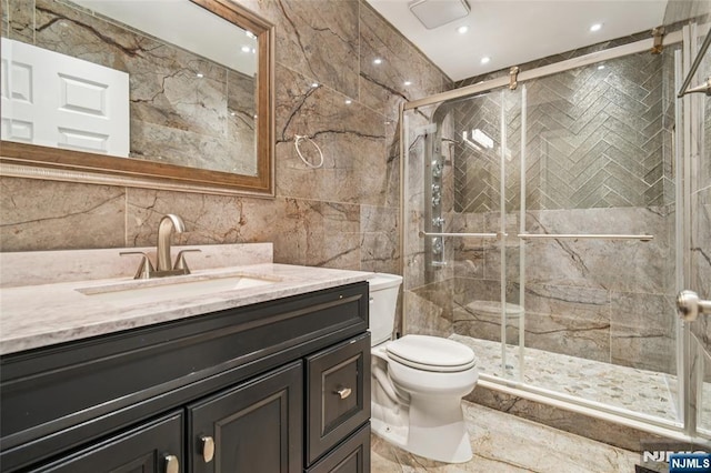 315 Winthrop Dr Unit 3082, Nutley, NJ 07110 - bathroom with tile walls, toilet, vanity, a stall shower, and recessed lighting