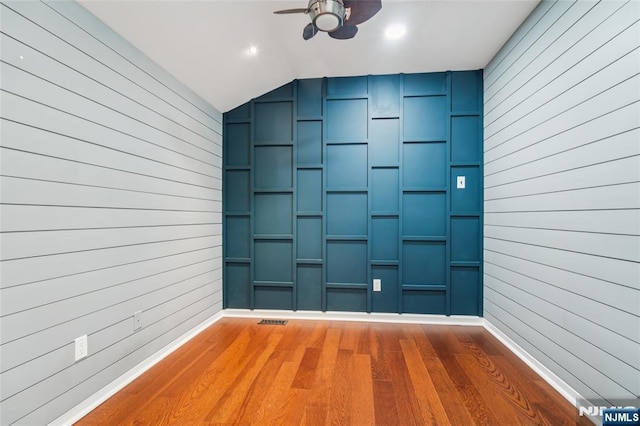 315 Winthrop Dr Unit 3082, Nutley, NJ 07110 - spare room with ceiling fan, wood finished floors, wooden walls, lofted ceiling, and baseboards