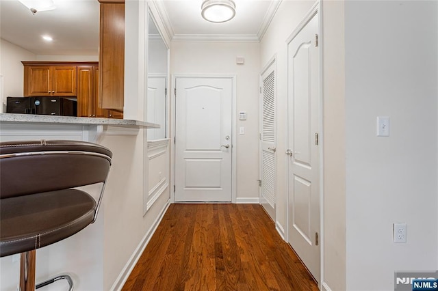 40 Azalea Dr, Old Bridge, NJ 08857 - corridor with dark wood-style floors, crown molding, and baseboards