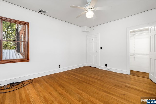 211 Harrison Ave, Hasbrouck Heights, NJ 07604 - empty room with light wood finished floors and ceiling fan