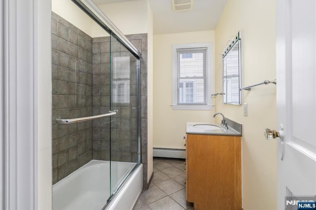 211 Harrison Ave, Hasbrouck Heights, NJ 07604 - full bath featuring a baseboard heating unit, vanity, tile patterned flooring, and shower / bath combination with glass door