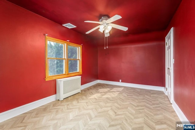 211 Harrison Ave, Hasbrouck Heights, NJ 07604 - empty room with radiator and a ceiling fan