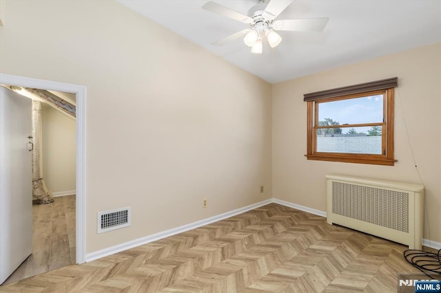 211 Harrison Ave, Hasbrouck Heights, NJ 07604 - empty room with radiator heating unit and ceiling fan