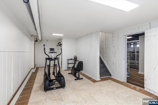 211 Harrison Ave, Hasbrouck Heights, NJ 07604 - workout area featuring separate washer and dryer and wooden walls