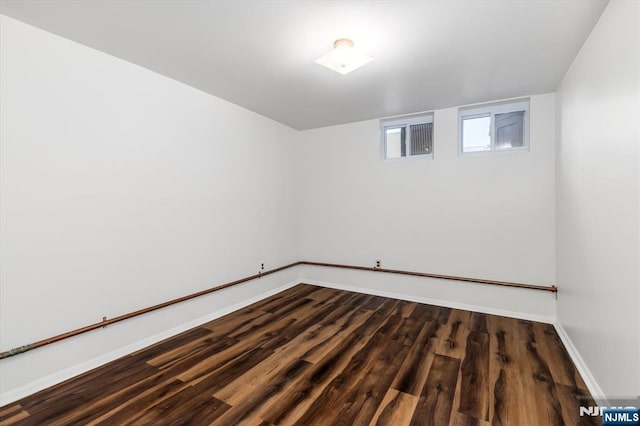 211 Harrison Ave, Hasbrouck Heights, NJ 07604 - unfurnished room featuring baseboards and dark wood-style floors