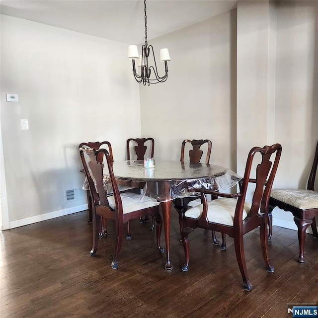 8 Tudor Pl Unit B08, Mount Olive Township, NJ 07828 - dining area featuring a chandelier, wood finished floors, and baseboards
