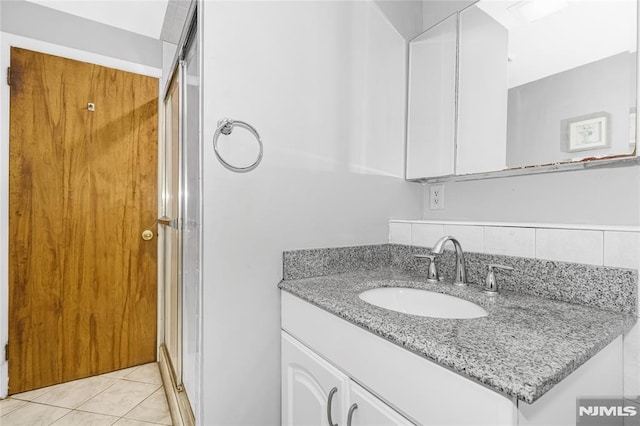 3 High St, Closter, NJ 07624 - bathroom with vanity, a shower stall, and tile patterned flooring