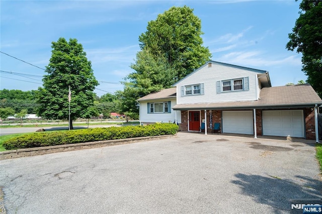 3 High St, Closter, NJ 07624 - split level home featuring asphalt driveway and brick siding