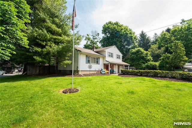 3 High St, Closter, NJ 07624 - split level home featuring a garage, a front lawn, a porch, and a chimney