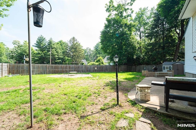 3 High St, Closter, NJ 07624 - fenced backyard with a storage unit and a patio area