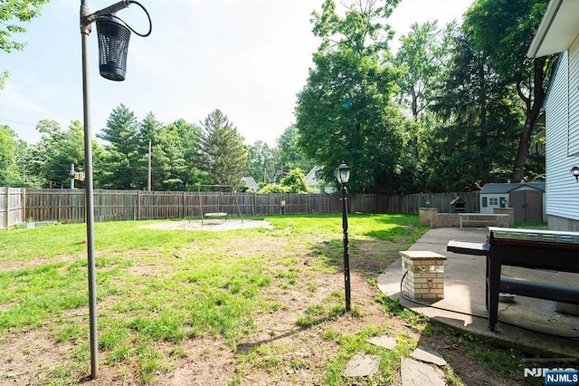 3 High St, Closter, NJ 07624 - fenced backyard with a storage unit and a patio