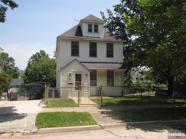 21 Overpeck Ave, Ridgefield Park, NJ 07660 - american foursquare style home with a porch, a gate, a fenced front yard, and a shingled roof
