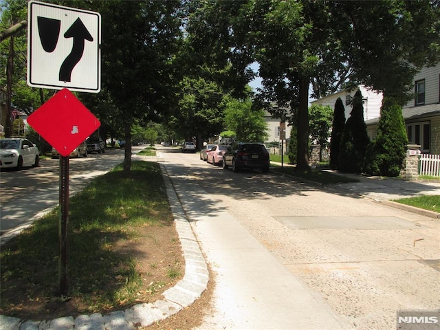 21 Overpeck Ave, Ridgefield Park, NJ 07660 - view of asphalt street with curbs, sidewalks, and traffic signs
