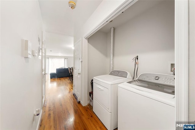 303-305 Runyon St, Newark, NJ 07108 - laundry area featuring separate washer and dryer and wood finished floors