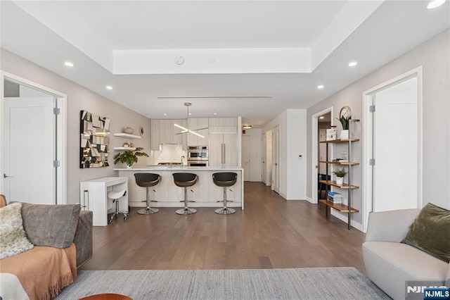 800 Ave At Port Imperial Blvd Unit 517, Weehawken, NJ 07086 - living room featuring dark wood-type flooring, recessed lighting, and baseboards