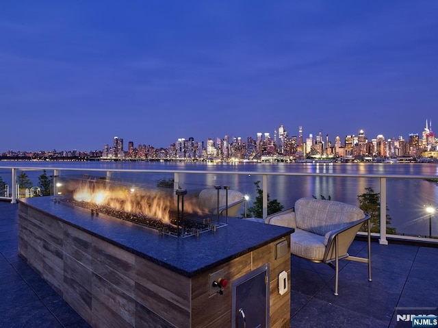 800 Ave At Port Imperial Blvd Unit 517, Weehawken, NJ 07086 - patio at night with a view of city lights and a water view