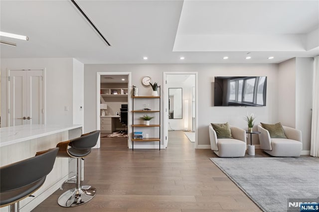 800 Ave At Port Imperial Blvd Unit 517, Weehawken, NJ 07086 - living room with wood finished floors, recessed lighting, baseboards, and a desk