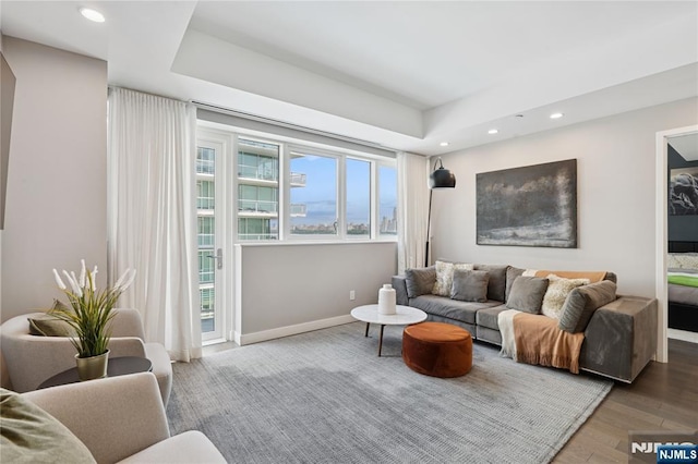 800 Ave At Port Imperial Blvd Unit 517, Weehawken, NJ 07086 - living room featuring recessed lighting, wood finished floors, baseboards, and a raised ceiling