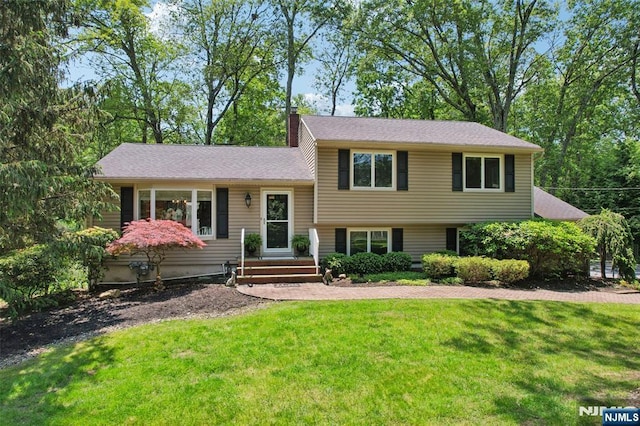 40 Fairhaven Dr, Allendale, NJ 07401 - split level home with a front yard and a chimney