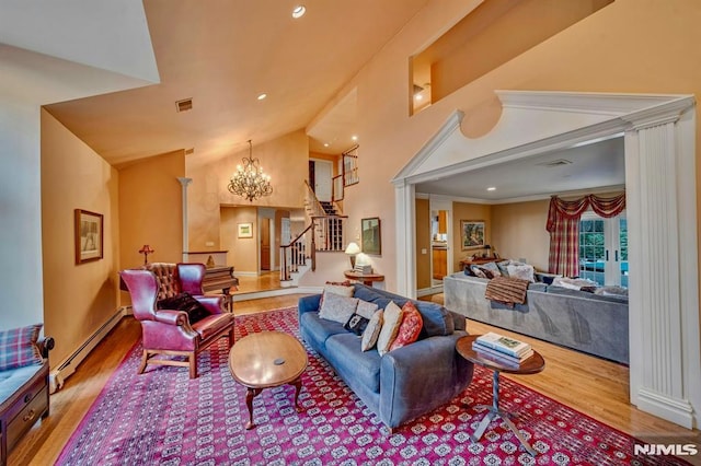 717 Ashmont Rd, Franklin Lakes, NJ 07417 - living area featuring a baseboard heating unit, wood finished floors, stairway, a chandelier, and high vaulted ceiling