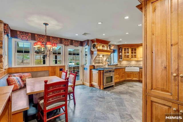 717 Ashmont Rd, Franklin Lakes, NJ 07417 - dining room featuring a chandelier, recessed lighting, and stone finish flooring