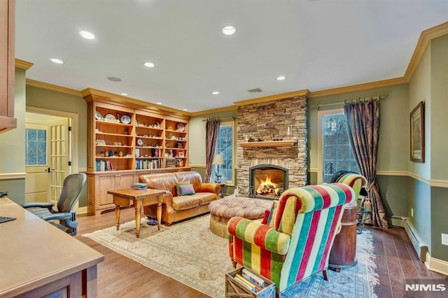 717 Ashmont Rd, Franklin Lakes, NJ 07417 - living room with ornamental molding, a baseboard heating unit, recessed lighting, baseboards, and a fireplace