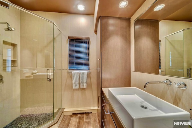 717 Ashmont Rd, Franklin Lakes, NJ 07417 - bathroom with wood finished floors, a shower stall, recessed lighting, and vanity