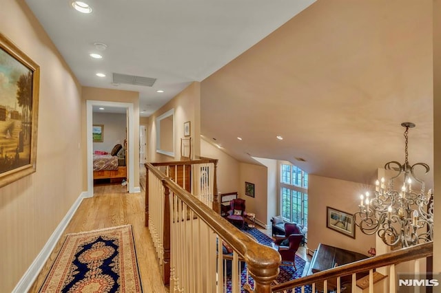 717 Ashmont Rd, Franklin Lakes, NJ 07417 - hall featuring an upstairs landing, light wood finished floors, a chandelier, recessed lighting, and baseboards