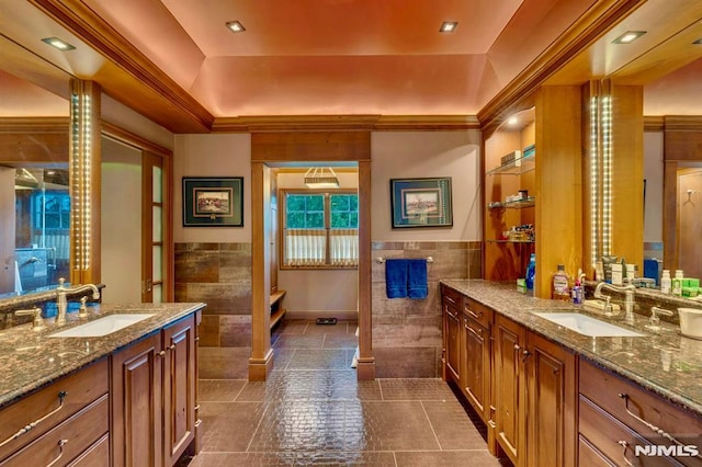 717 Ashmont Rd, Franklin Lakes, NJ 07417 - full bathroom featuring tile walls, two vanities, tile patterned flooring, a wainscoted wall, and a raised ceiling