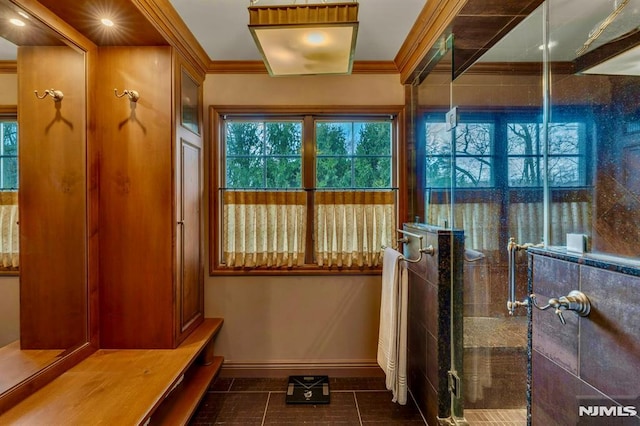 717 Ashmont Rd, Franklin Lakes, NJ 07417 - bathroom with baseboards, healthy amount of natural light, tile patterned flooring, a stall shower, and crown molding